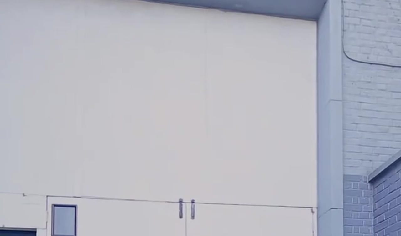 The entrance side of the building seen from the yard